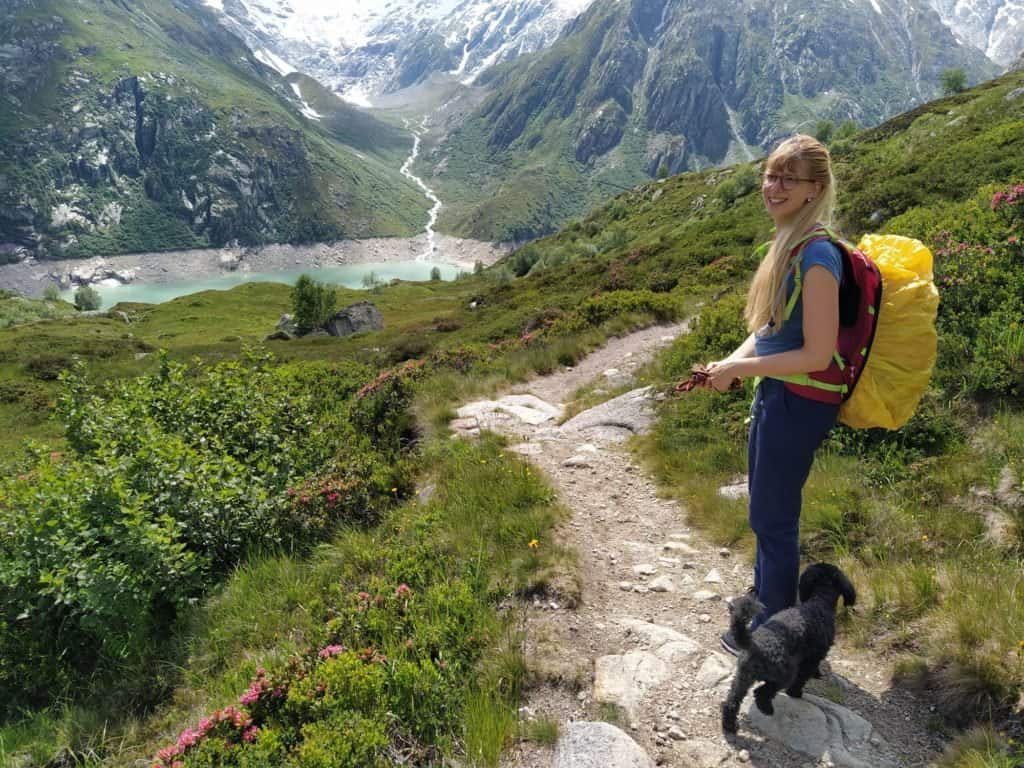 me hiking with my small dog - baloo is a mini poodle, and we're in the mountains!